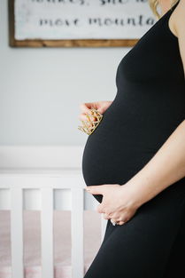 怀孕初期小腹坠痛像来例假正常吗？